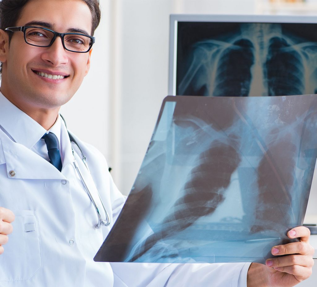 Radiologist reading and reviewing x-ray image and preparing report